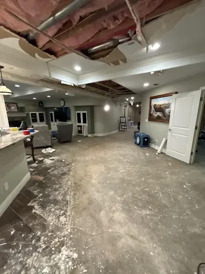 Opened ceiling and drying equipment in a water-damaged Aurora home