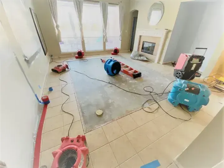 Drying equipment set on a tile floor during an Aurora water damage job