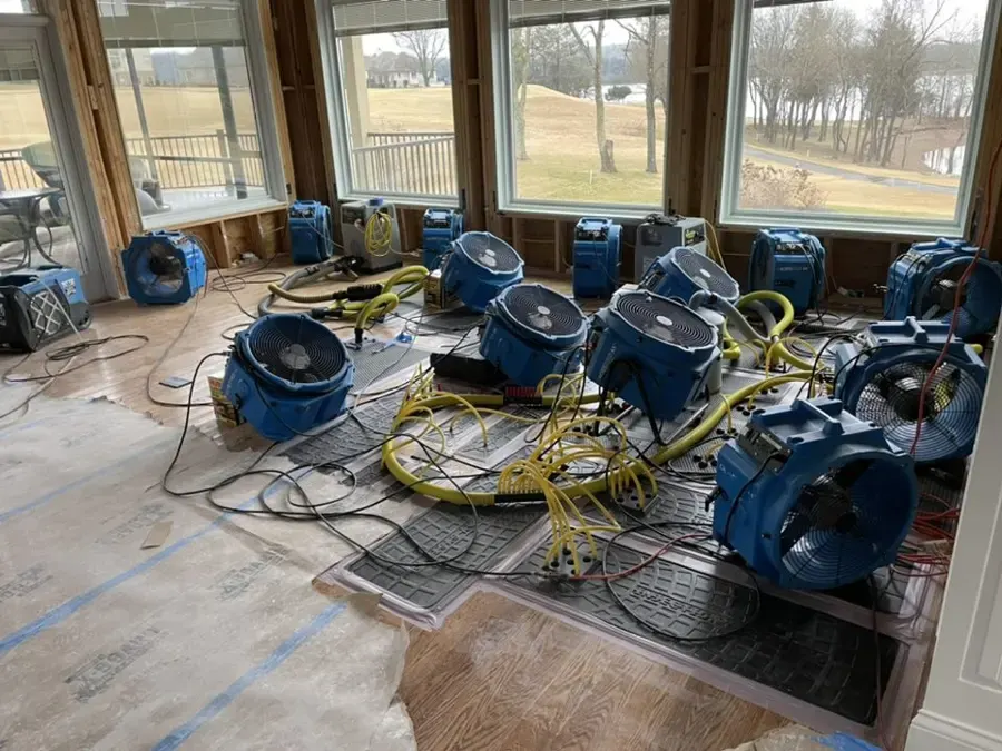 Drying equipment running across a flooded Aurora commercial floor