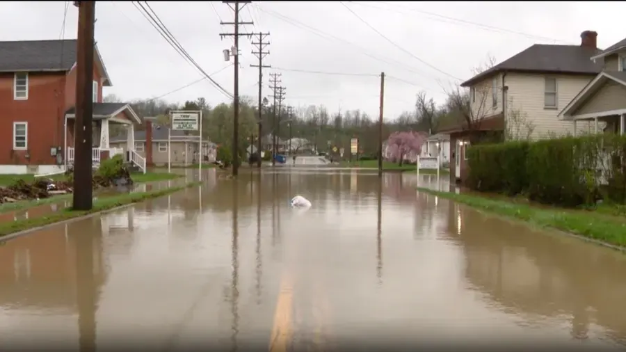 Storm water flooding a street and yards after a summer cloudburst in Aurora